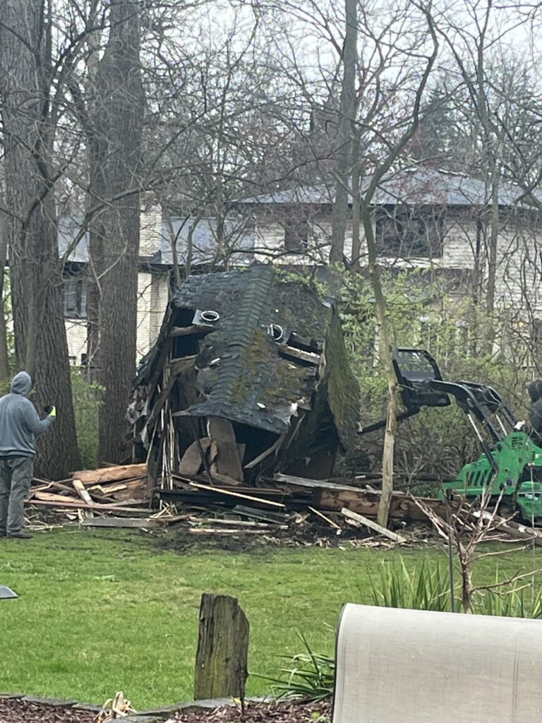 Shed demolition knocking down a wood shed junk removal services