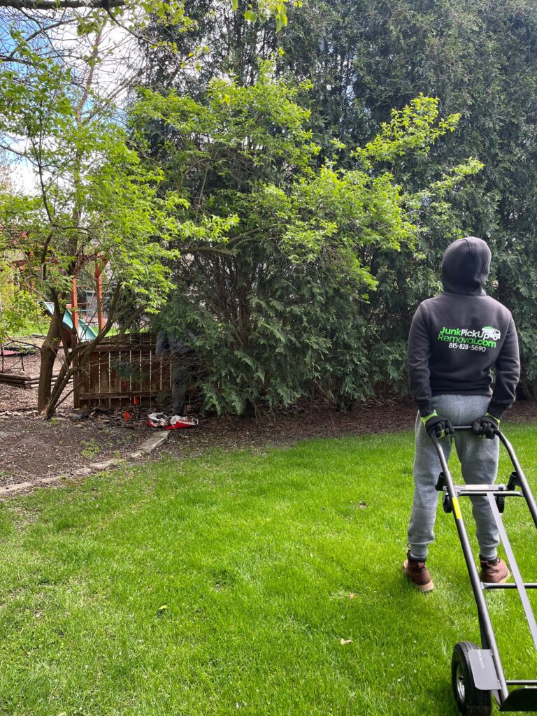 Fence Removal in Naperville Illinois where Junk Pickup Removal removes a large wooden fence that surrounds the customer's property