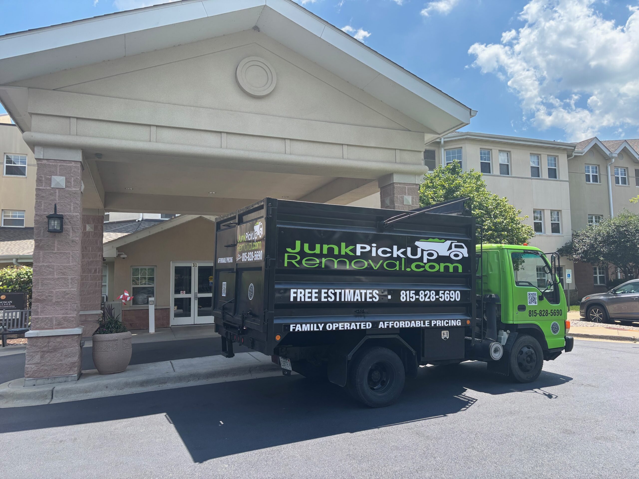 Junk Pickup Removal Truck picking up furniture from Assisted Living Facility